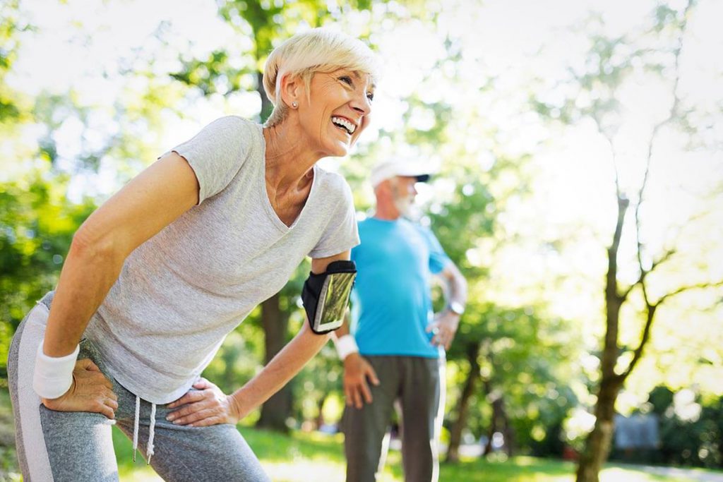 Older woman outside exercising